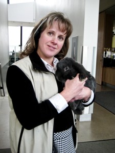 rgbbbb ulieLyn Anderson, ecology office co-ordinator, holds a rabbit, one of many animals in the arb. Photo by Colton De Gooyer.