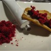 Almond and pistachio wafers, chocolate ganache “tube” and raspberry crumbles. PHOTO COURTESY OF RUDI FISCHBACHER