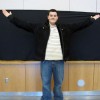 PHOTO BY LISA GILLAN  Marc-Anthony Sinagoga, founder of FunnyMan Inc. stands in the Richmond Hill Centre for the Performing Arts where he will host a show March 9.