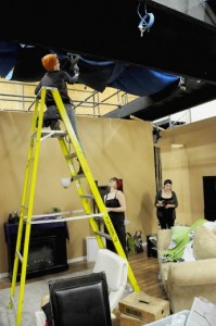 Adam Stroud Erika Osmani disassembles the set atop a ladder as part of the second year studio dramas project in the film and television production program.