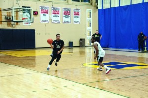 RJ Ramirez moves the ball up the court in practice. (Jeff Sehl)
