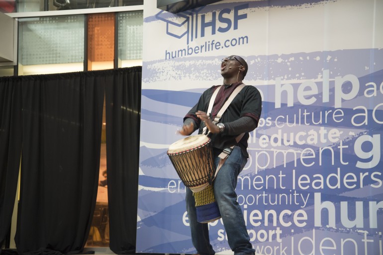 Babarinde Williams starts his presentation with a drum solo.