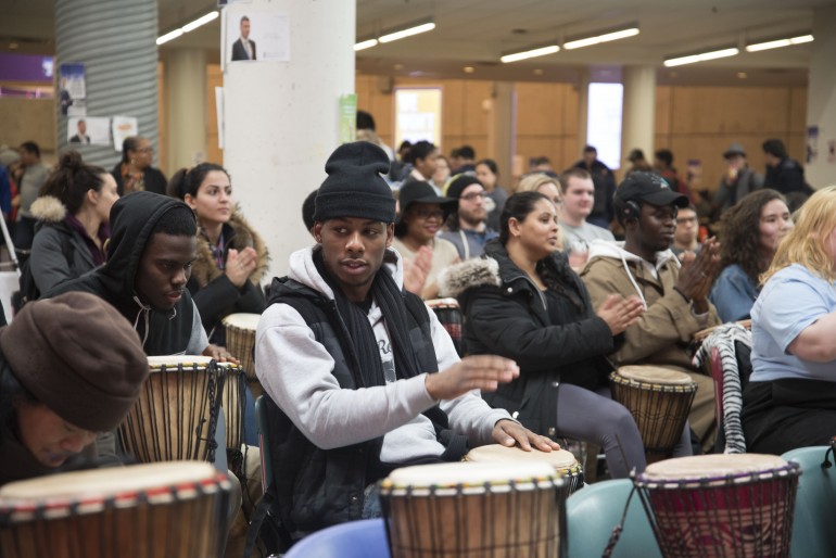 Humber College's students and faculty members participates in drumming workshop.