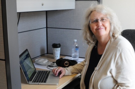 New media professor, Sherry Coman, pictured in her office at Lakeshore, created a panel called Higher Learning: Emerging Filmmakers Talk Spiritual and Cultural Identity.