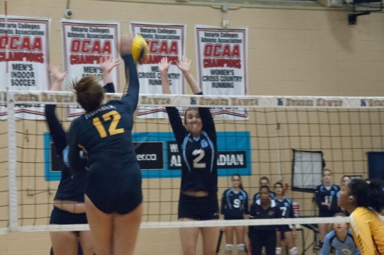 (Elliott Williams) Humber's Devan O'Connor blasts one of her team leading ten kills past Sheridan's defence