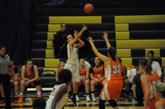 Hawks’ guard Amber Bechard attempts a long range shot. (Elliott Williams)